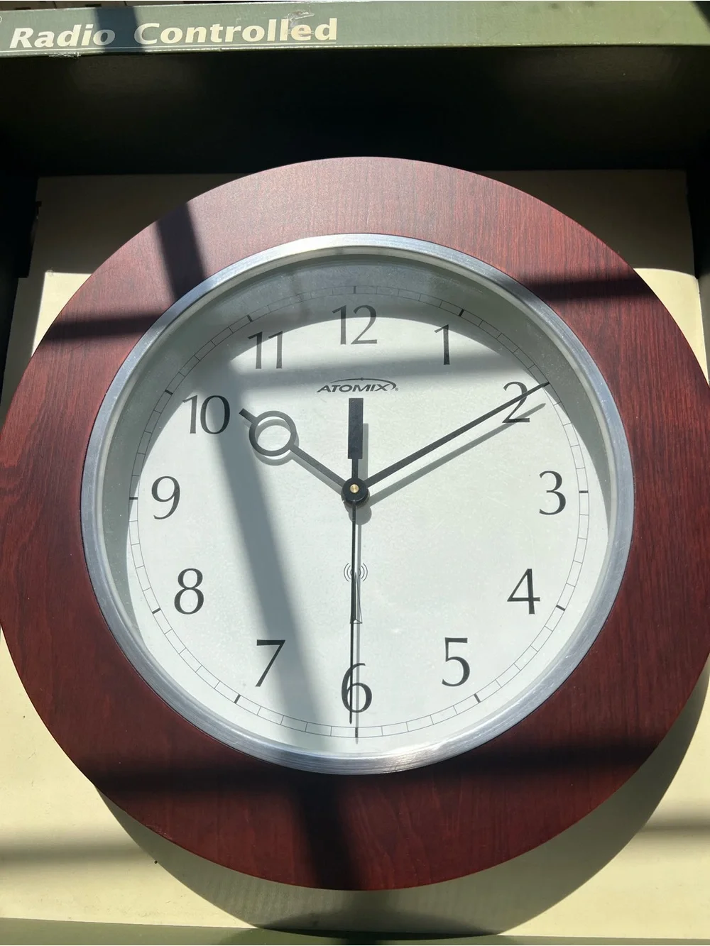 Classic Wood-Frame Wall Clock in Brown and White